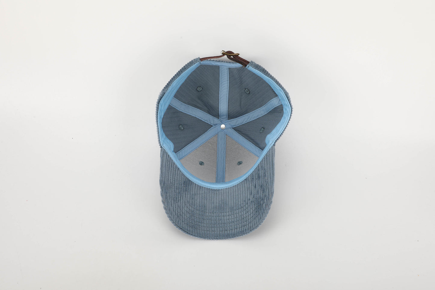 unisex blue corduroy cap orange stitching brown leather buckle strap baseball cap inside view