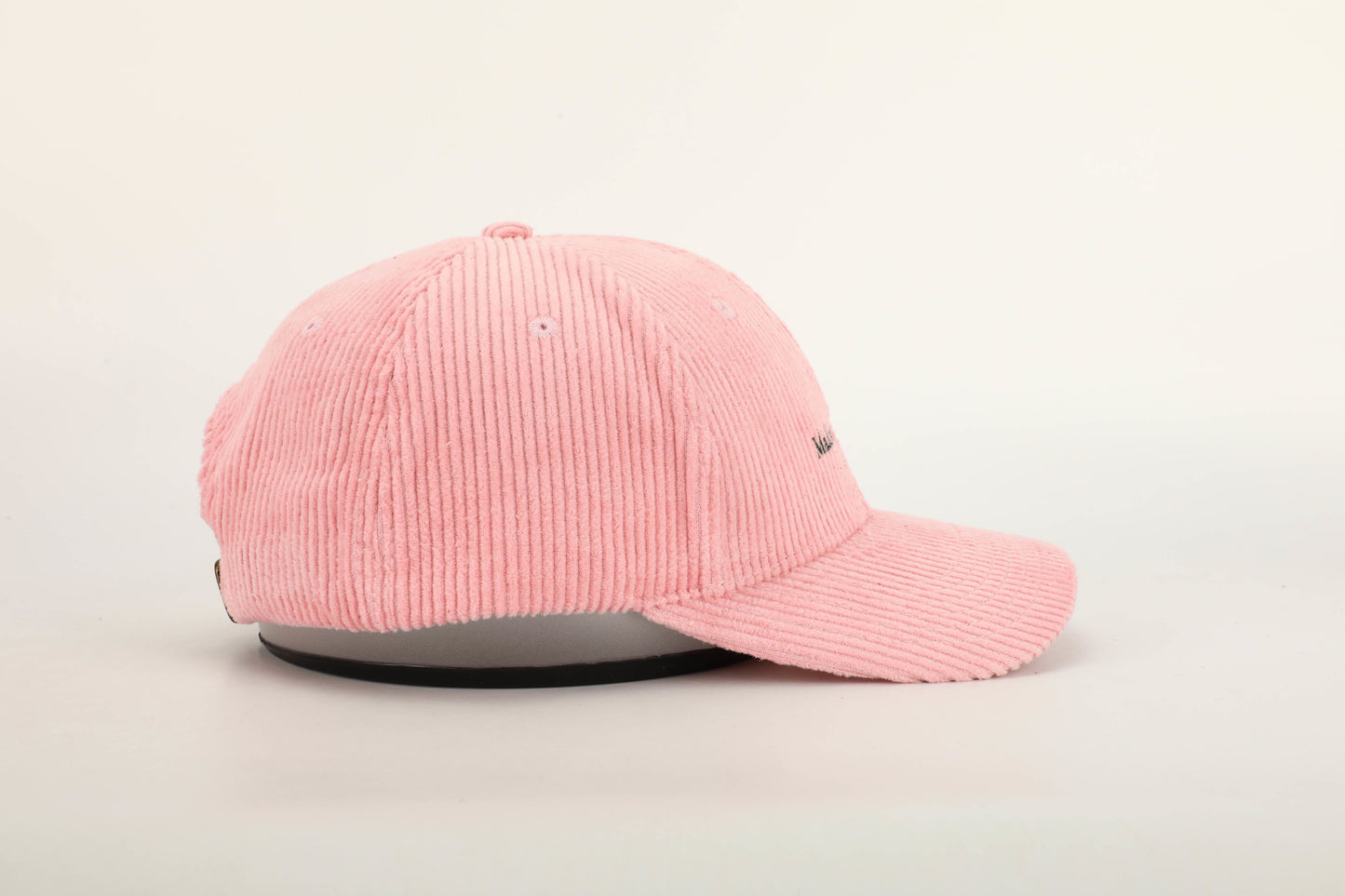 unisex pink corduroy cap green stitching brown leather buckle strap baseball cap side on