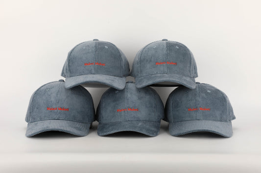 unisex blue corduroy cap orange stitching brown leather buckle strap baseball cap five caps face on